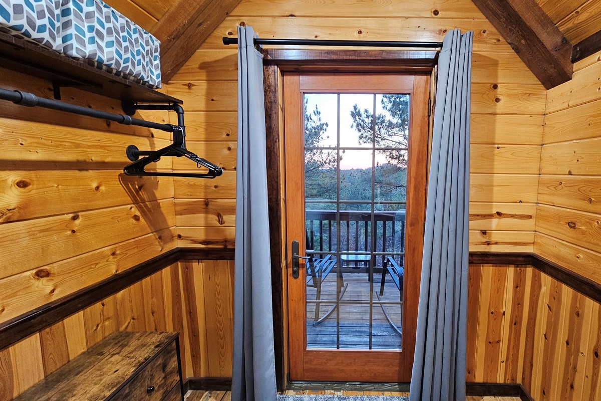 Step out for sunrise coffee: private balcony with forest views right off the room.