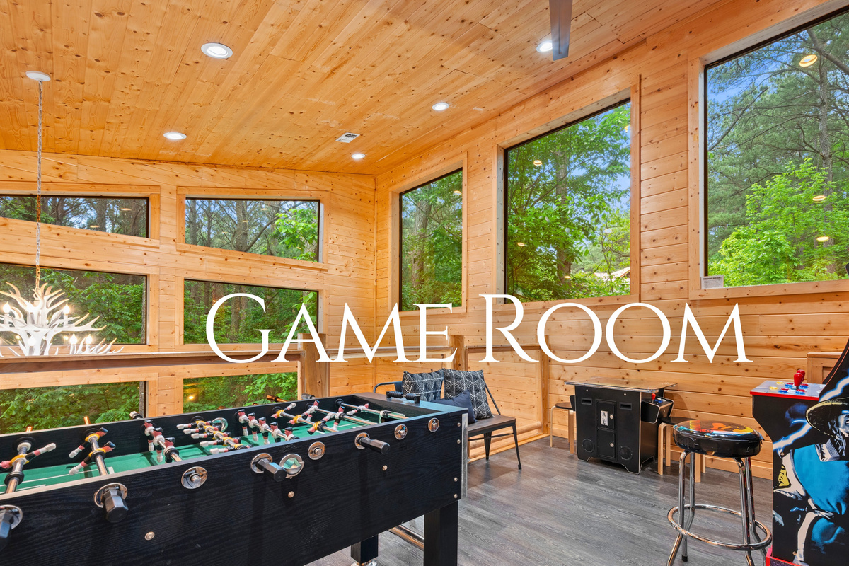 The game room is ready for fun, with a foosball table and plenty of space to gather and enjoy some friendly competition.