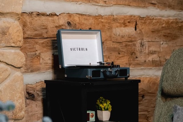 Relax with the timeless sounds of vinyl from the Victrola record player.