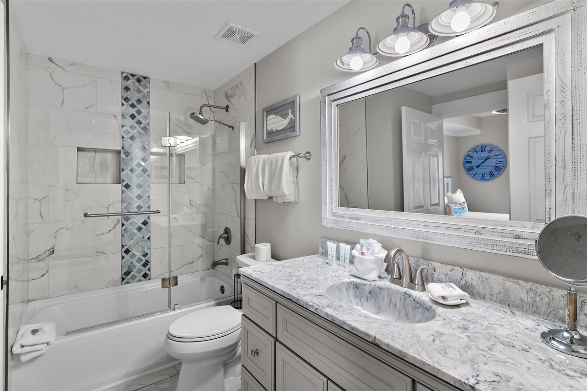 Guest bathroom has new countertops, updated shower/tub combo