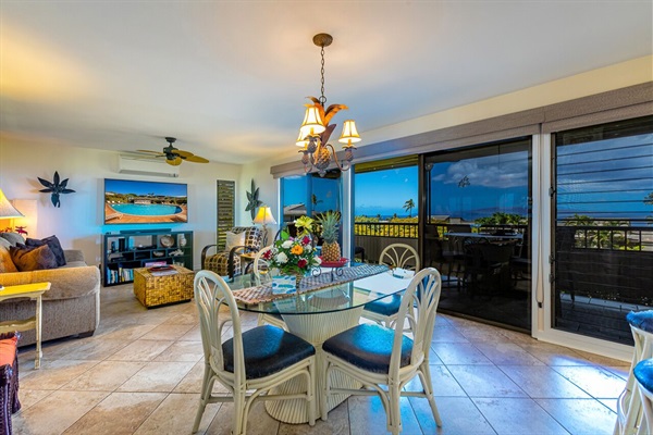 Living room and Dining area inside or out on the Lanai with a view of the ocean 