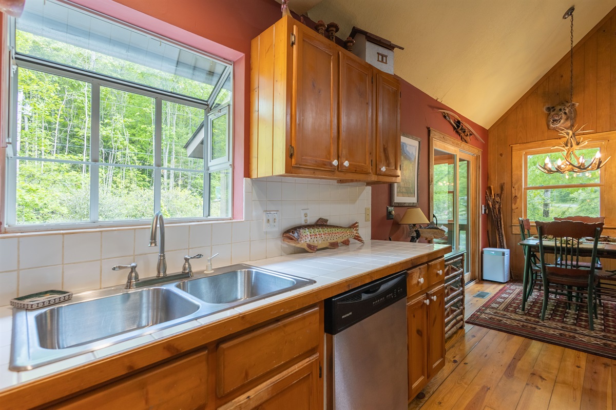 A charming garden window above the sink brings in natural light and peaceful views while you cook or clean up.
