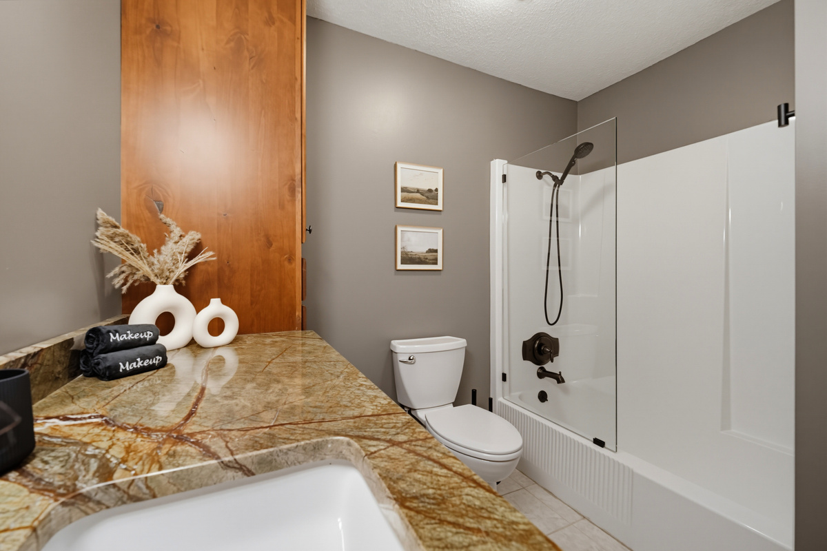 {Bath 2} Bright, welcoming, and thoughtfully designed, this full bathroom offers generous counter space and modern finishes for a comfortable stay.