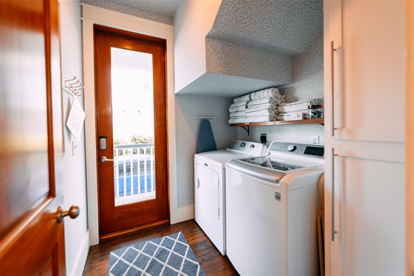 Laundry room with storage and 16 beach towels provided for your stay