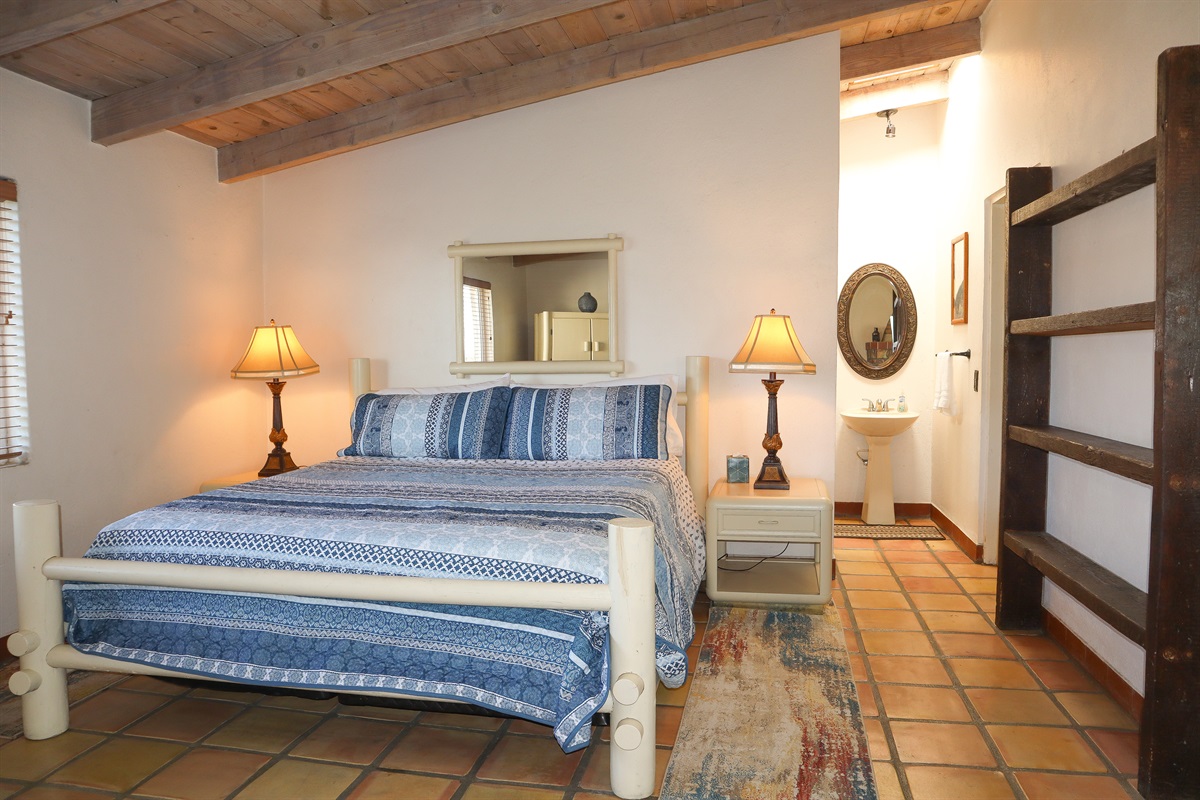 Circa Del Mar - Master Bedroom with King bed, en-suite bathroom, and fireplace.