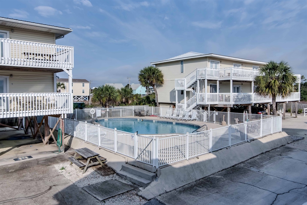 Outdoor Communal Pool - The outdoor pool is centrally located in the complex and offers lounge chairs and seating for hanging out and soaking up the sun.