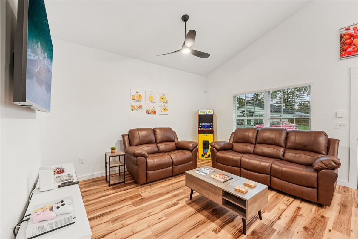 Comfortable reclining sofas, full-size Pacman arcade game (with Galaga and many other games) coffee table lifts up, board games in table.