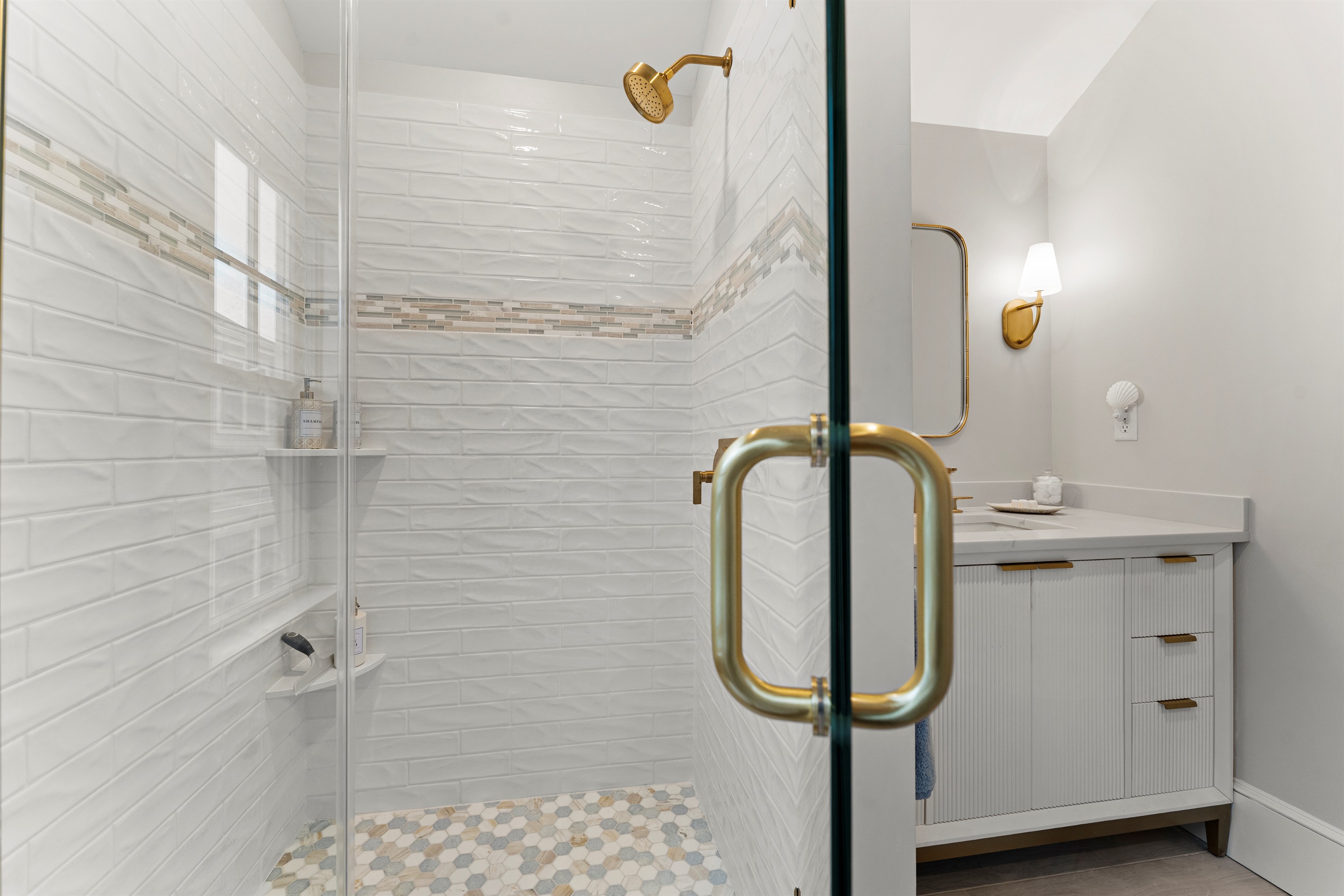 Step into the walk-in shower for a relaxing experience.