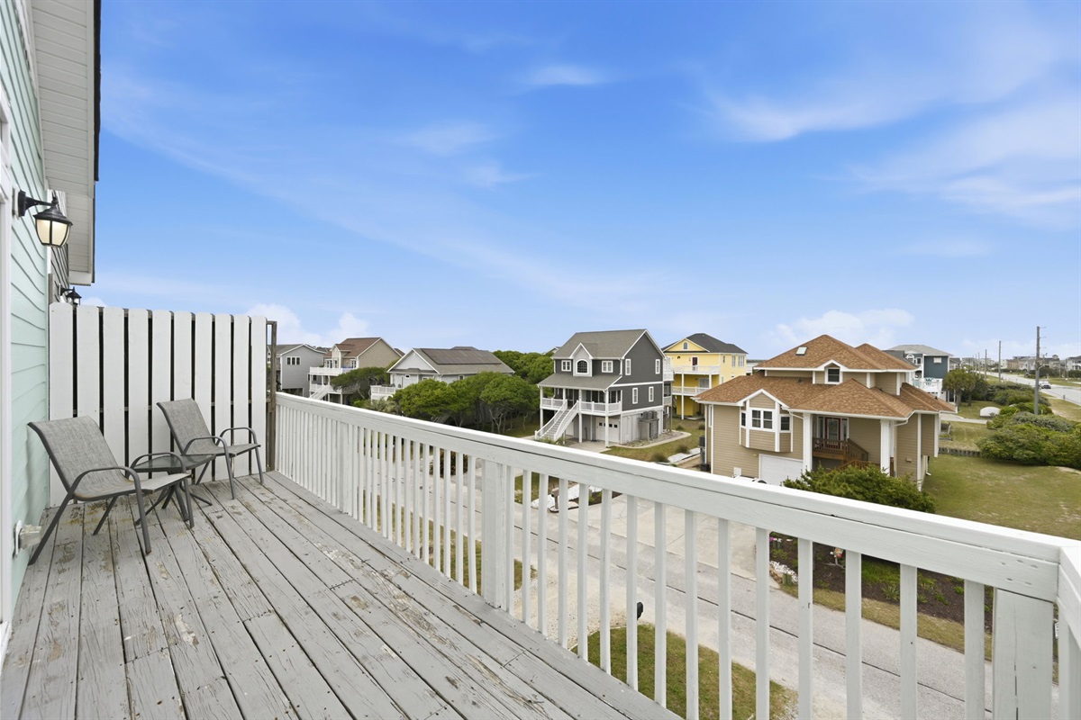 Private deck with lounge seating and open coastal views