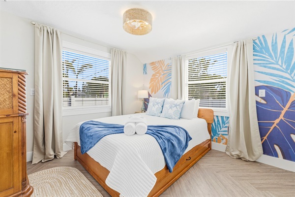 Second bedroom with Queen sized bed, twin trundle, Smart TV, blackout curtains. full sized mirror, dresser. 