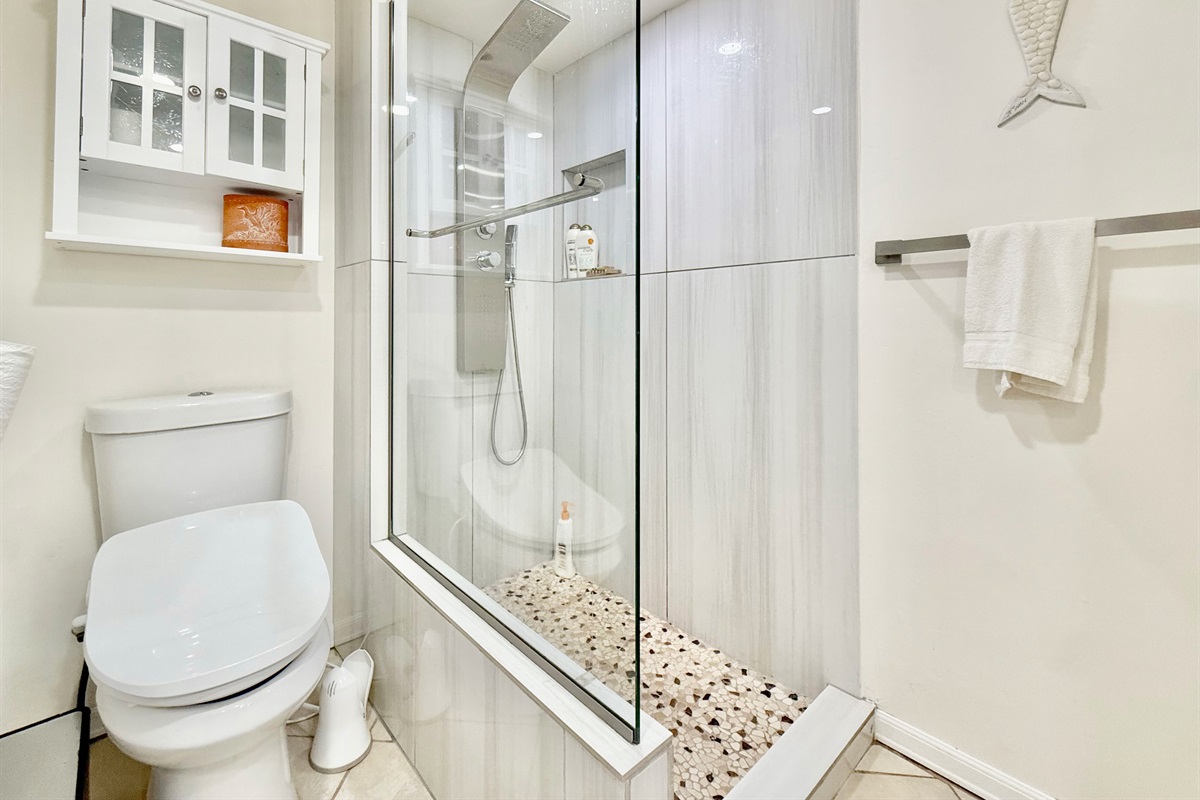 Large shower and vanity in the guest bathroom