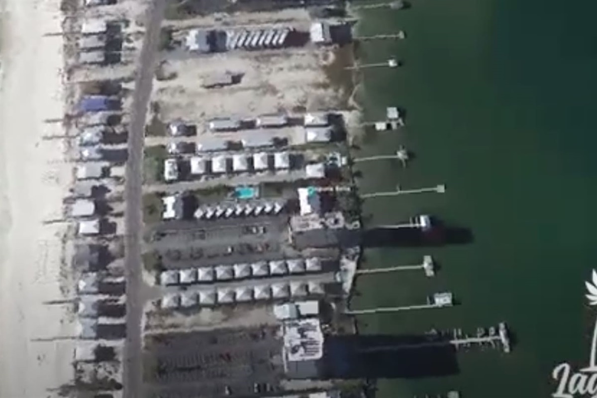 Coastal marina charm with serene waters, scenic boats, and beachside retreats at “Bliss on the Bay” by the Laguna Bella, Gulf Shores, AL.