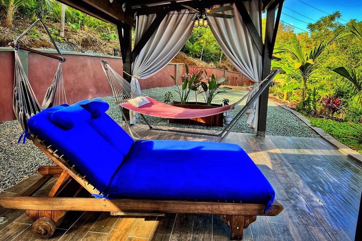 Sitting outside and enjoying the view from the house was very peaceful; Lounge outside and take in tranquil surroundings from this comfortable setup.