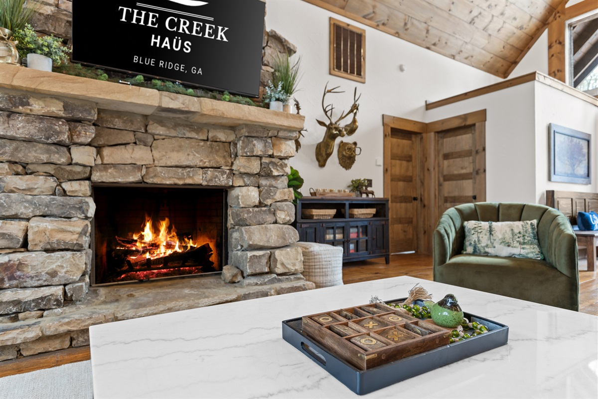 Imagine curling up by the warm, crackling fire, wrapped in a soft blanket, while your favorite show plays in the background. It&rsquo;s the perfect setting for relaxation and comfort. A place where you can truly unwind and feel at home.