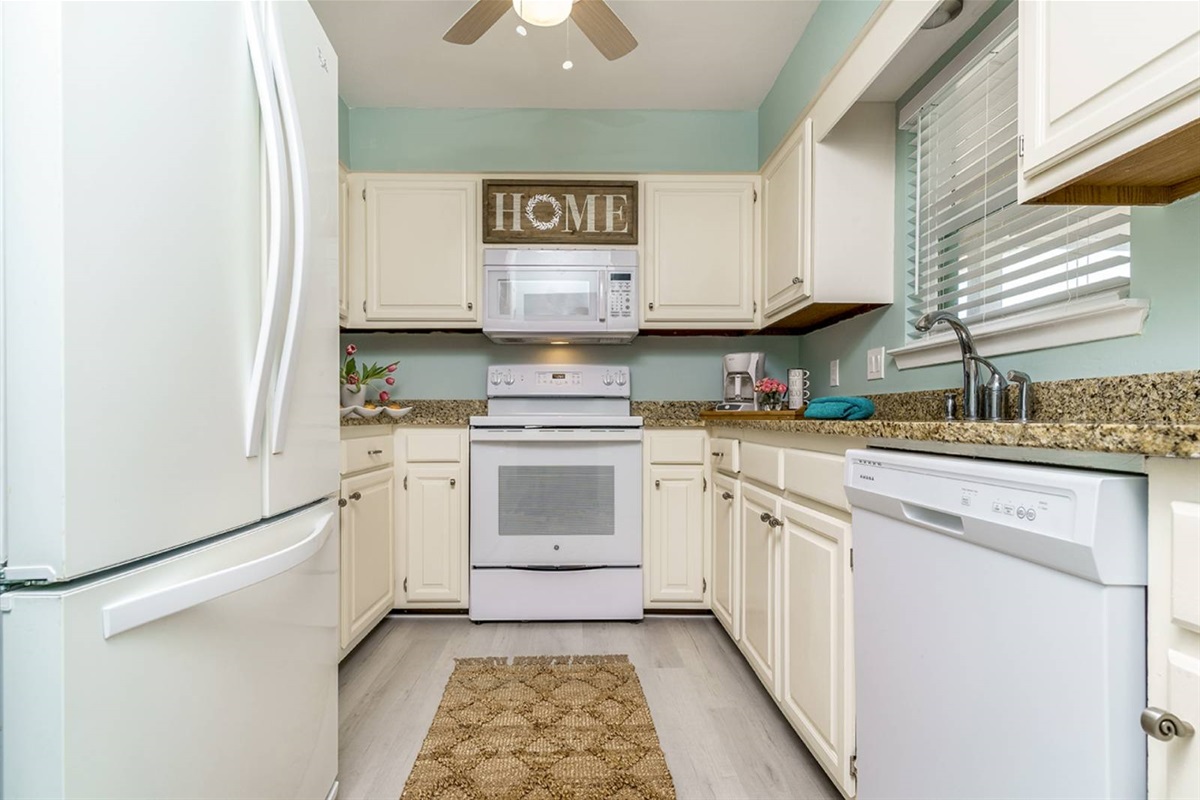 Fully equipped galley kitchen at this dune-front retreat. Granite counters, full-size appliances, and everything to cook for 6.