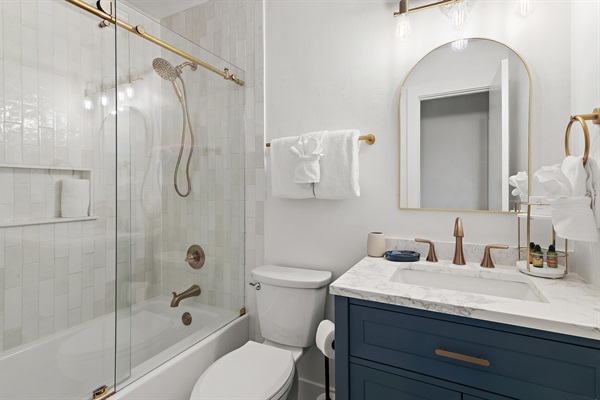 Beautiful brand new hallway bathroom with full bathtub and shower! Custom tile, sliding glass door, modern finishes. 