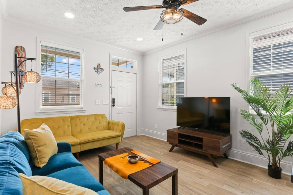 Enjoy a bright, cozy living room with colorful decor & 50" Roku TV—perfect for movie nights!