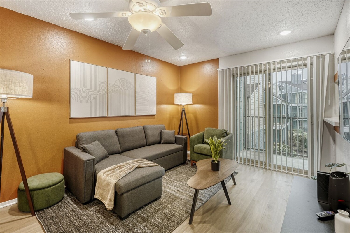 Cozy modern retreat with warm tones, comfy seating, and plenty of natural light