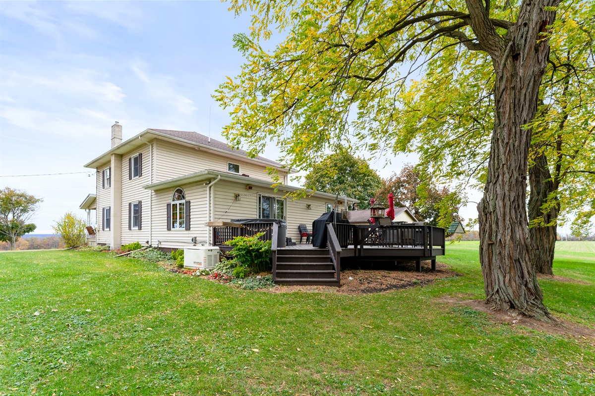 Charming home surrounded by lush trees — perfect blend of comfort and nature for your getaway.