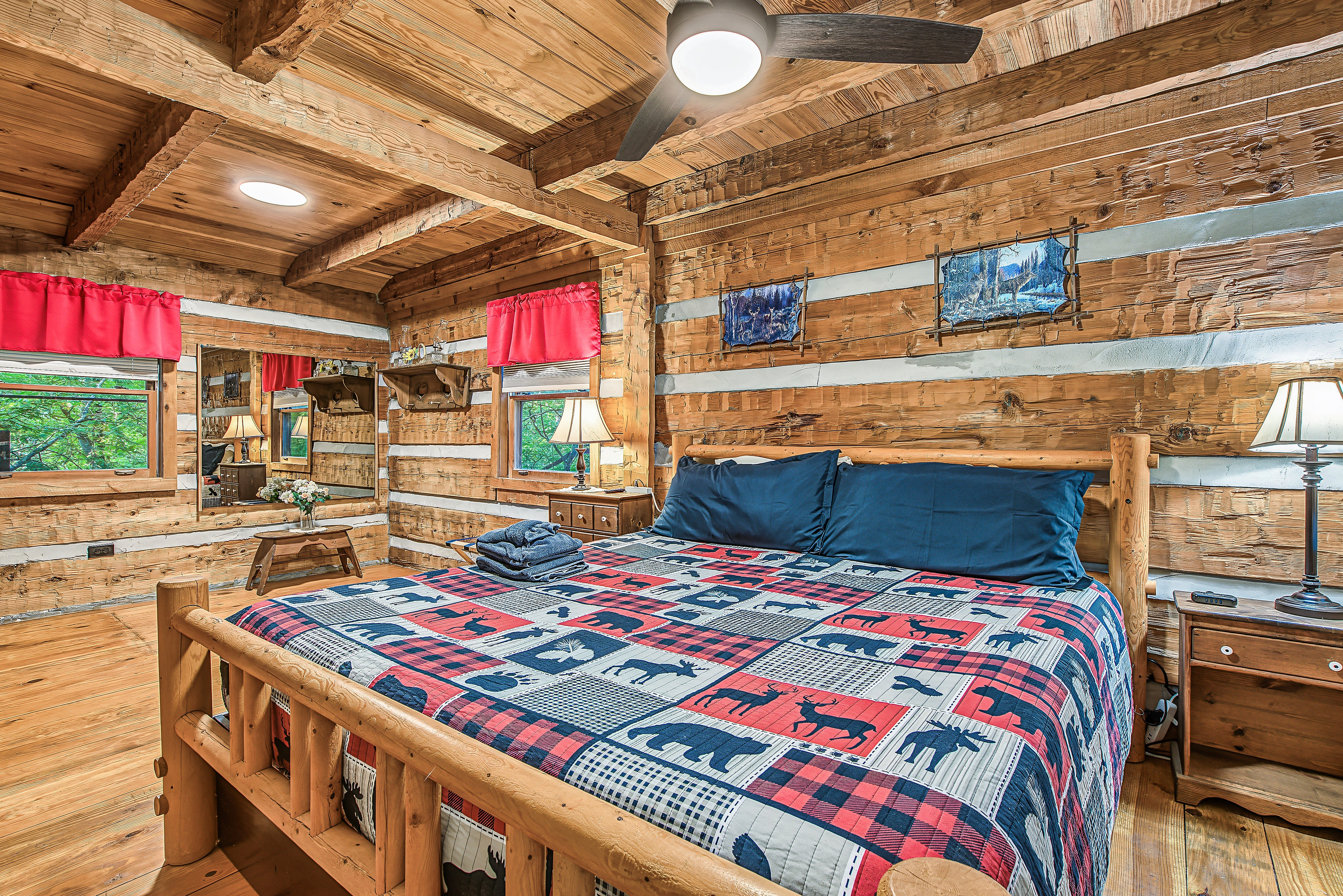 A charming log cabin bedroom with a warm, rustic feel.
