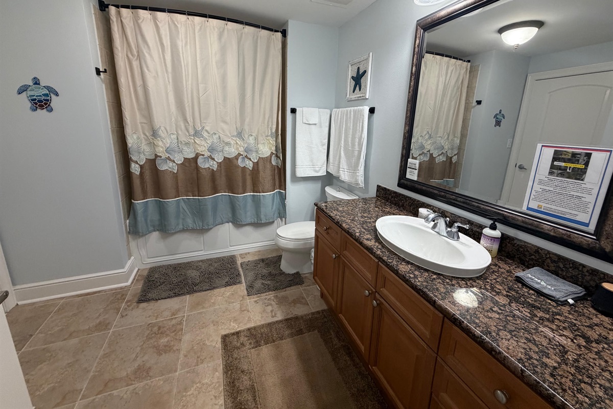 A bright, well-kept guest bathroom with everything your family needs for a comfortable stay.