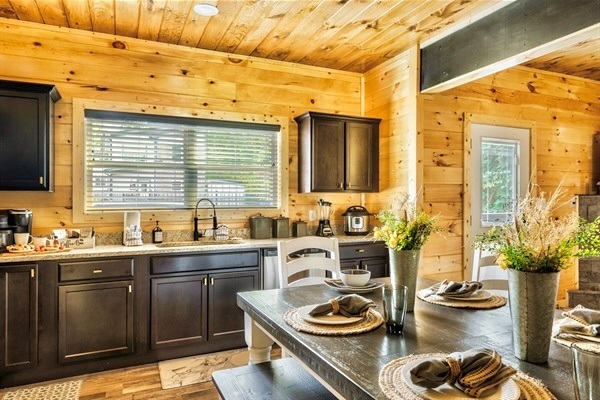 Elegantly designed kitchen with a large dining table, insta Pot, and modern amenities to inspire your culinary creativity