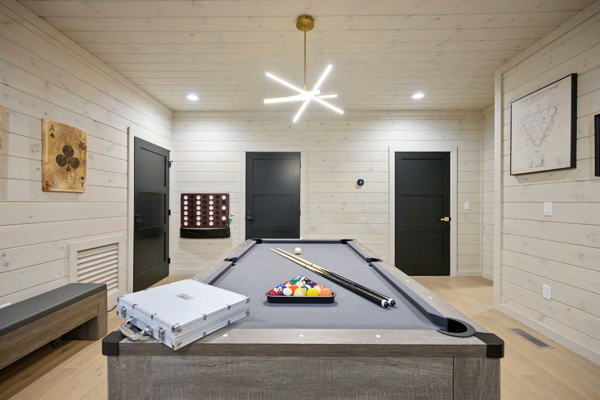 The pool table easily converts to a ping pong table top or a game table top and also has benches for seating.