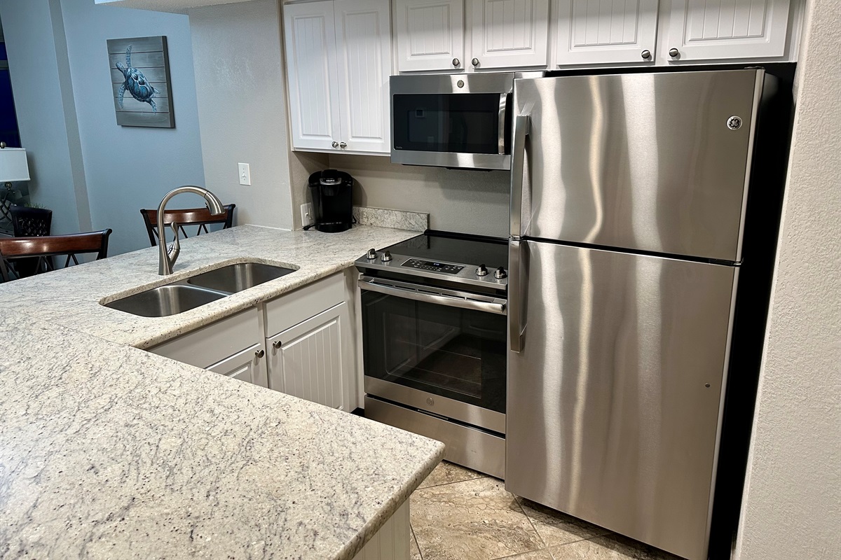 The kitchen has everything you'll need plus a gorgeous ocean view from the sink.
