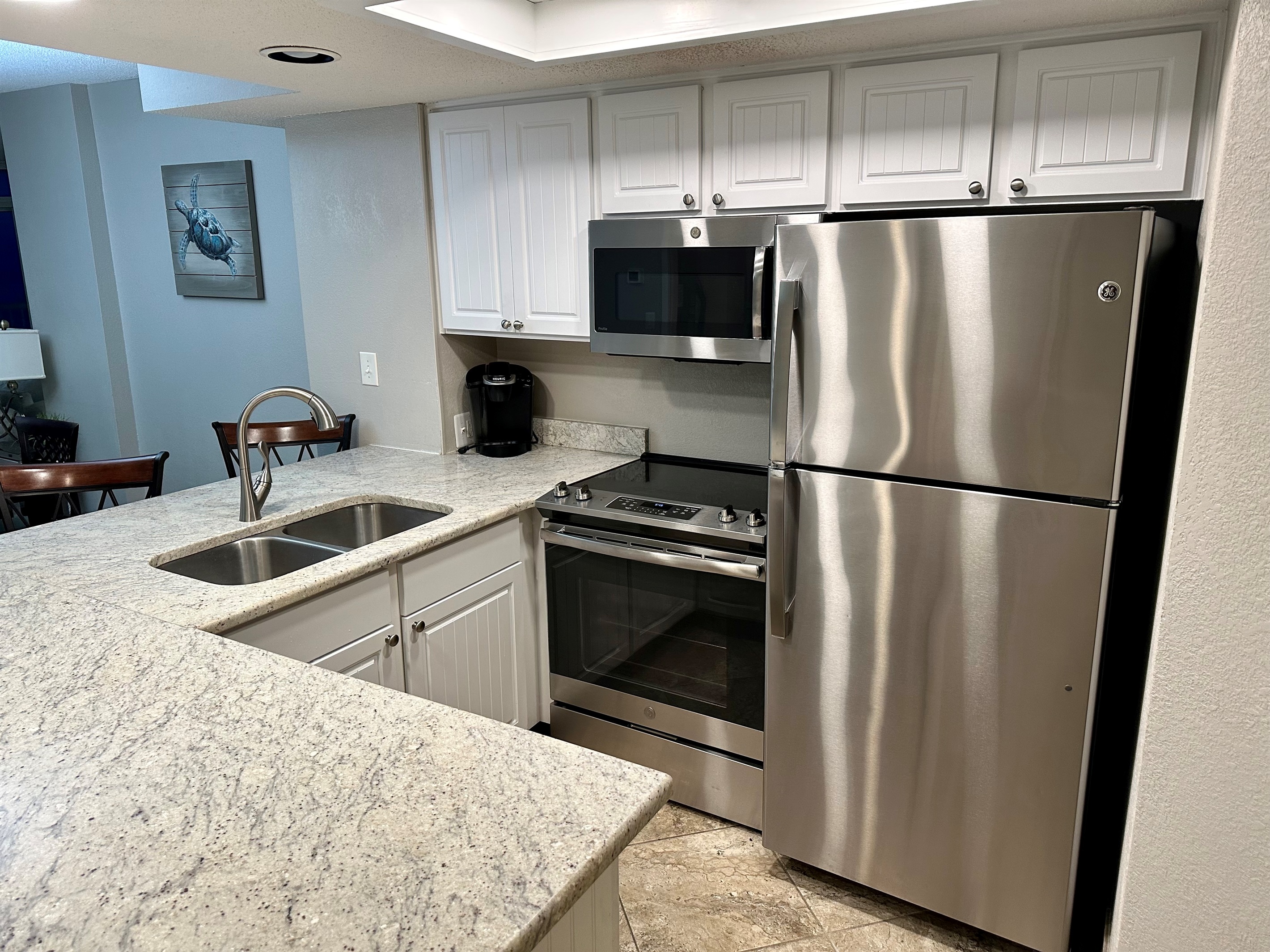 The kitchen has everything you'll need plus a gorgeous ocean view from the sink.