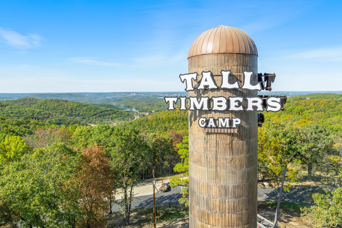 Welcome to Tall Timbers Camp, a landmark water tower rising over the wooded Ozark hills just minutes from Branson.