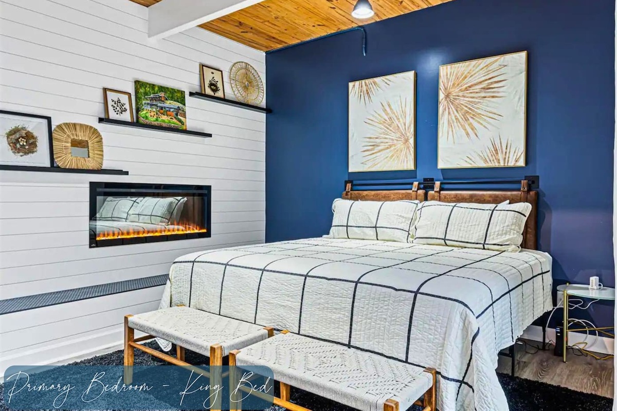 Primary Bedroom with Gas Fireplace and Seating on the Lower Level