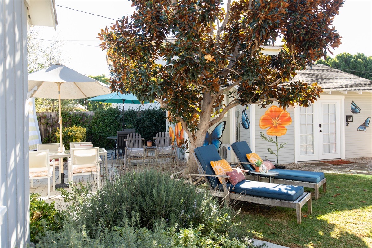 Lush garden + floral murals = instant calm 🌸🦋