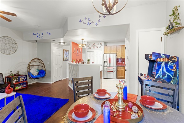 Spacious and open-concept living area with a cozy sitting nook and a fully equipped kitchen. Perfect for entertaining guests or enjoying a quiet night in.