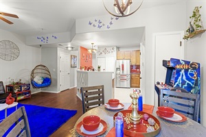 Spacious and open-concept living area with a cozy sitting nook and a fully equipped kitchen. Perfect for entertaining guests or enjoying a quiet night in.