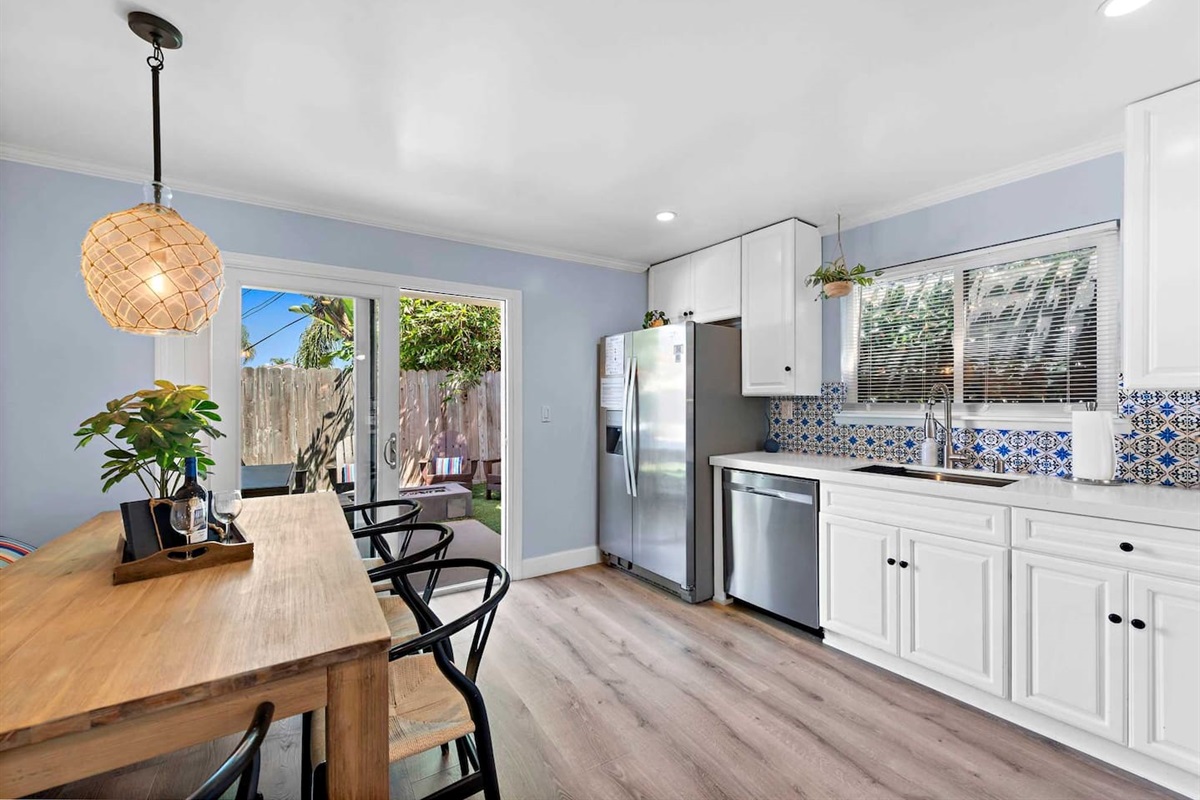 Table seats 6 comfortably and the back yard is just off the kitchen if you prefer to eat outside.