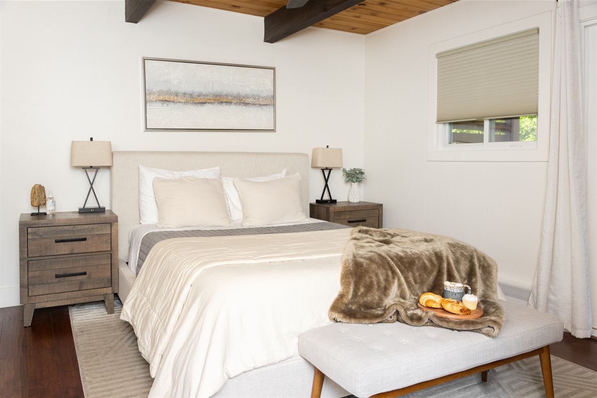 Cozy, private primary bedroom, with private en suite bathroom and shower.