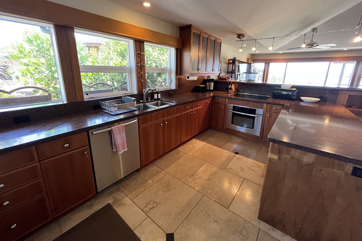 Kitchen with a stunning and magnified view of Three Tables Beach & Shark's Cove.