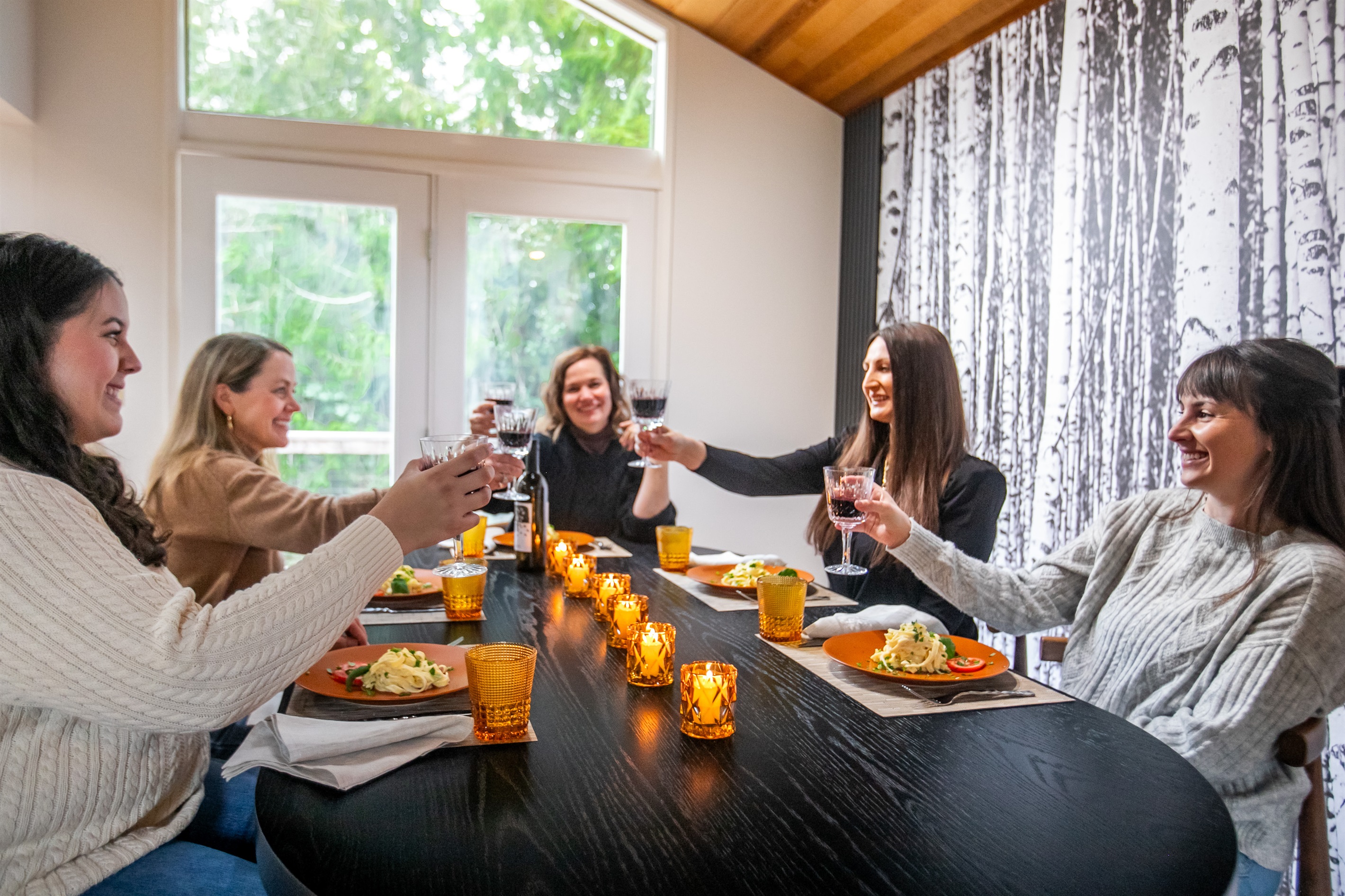 Share a meal with family or friends in our stunning birch forest mural dining room with vaulted cedar ceilings.