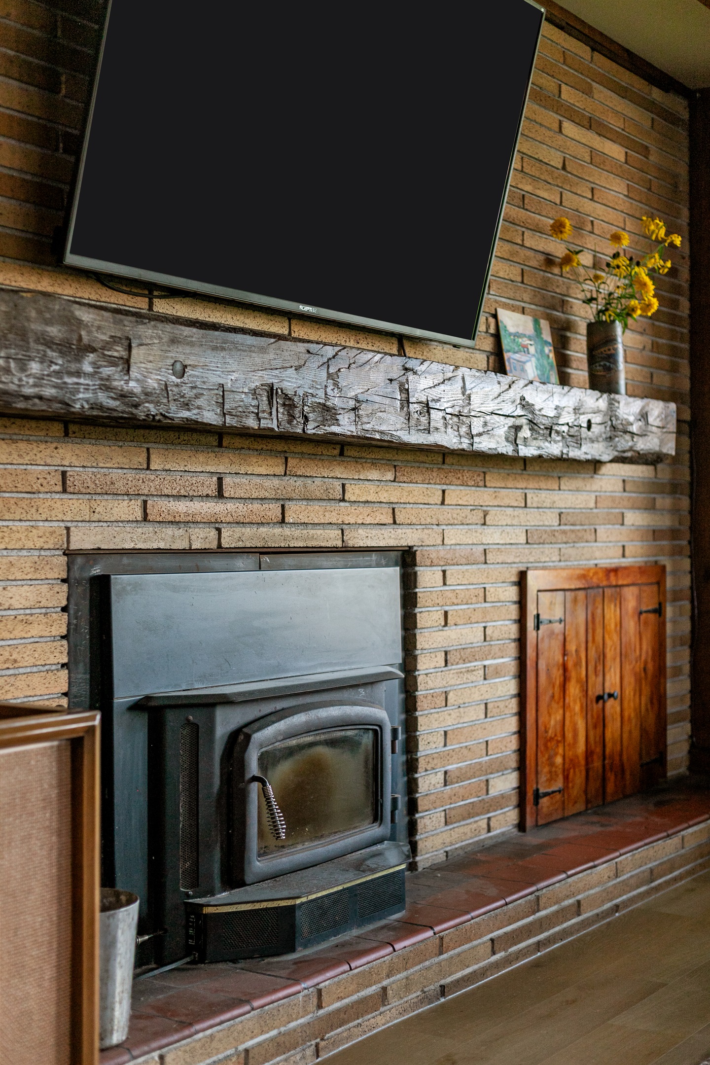 Cozy up by the wood-burning fireplace, the perfect spot to gather, unwind, and enjoy the warm glow on cool evenings.