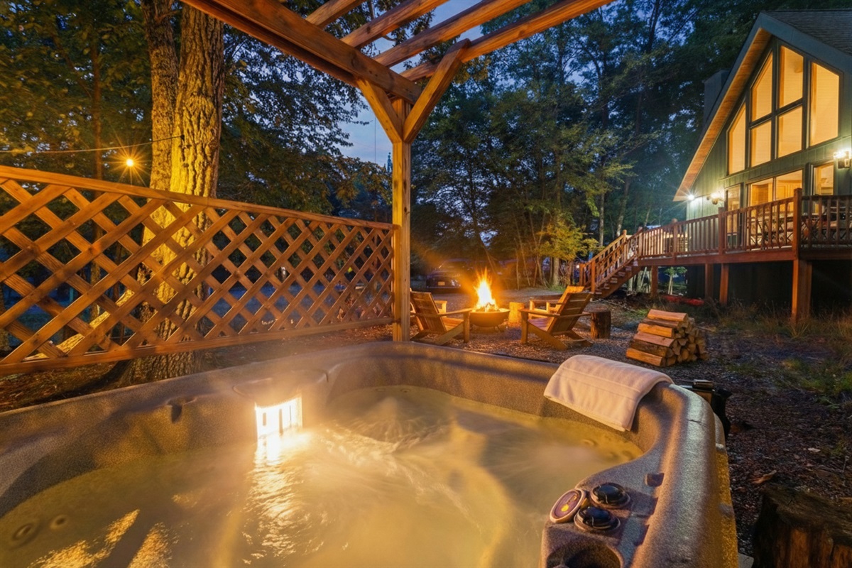 Sit and soak in your private hot tub overlooking the firepit and distinctive architecture of the Black Forest Chalet