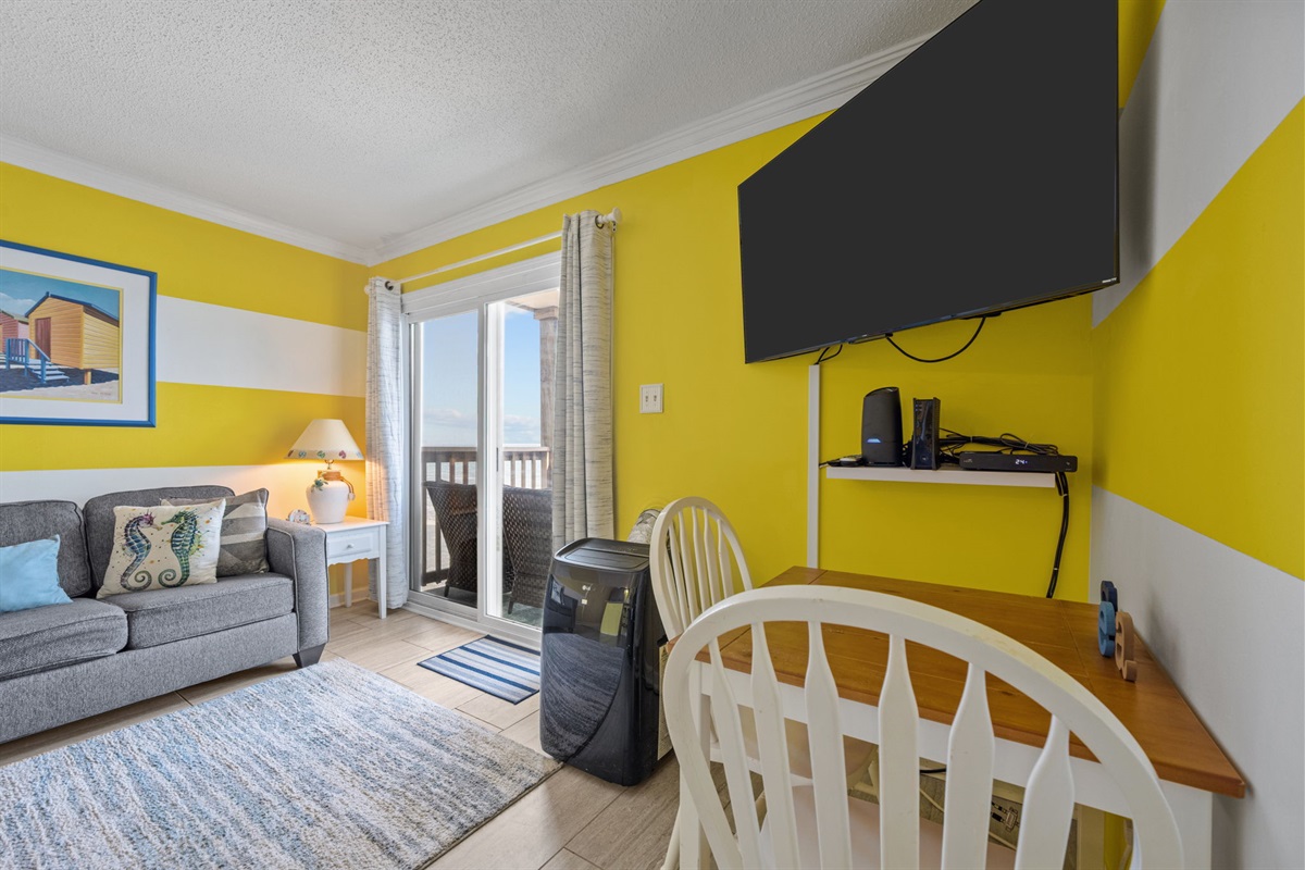 Small dining nook perfect for morning coffee, quick bites, or planning the day&rsquo;s beach adventures