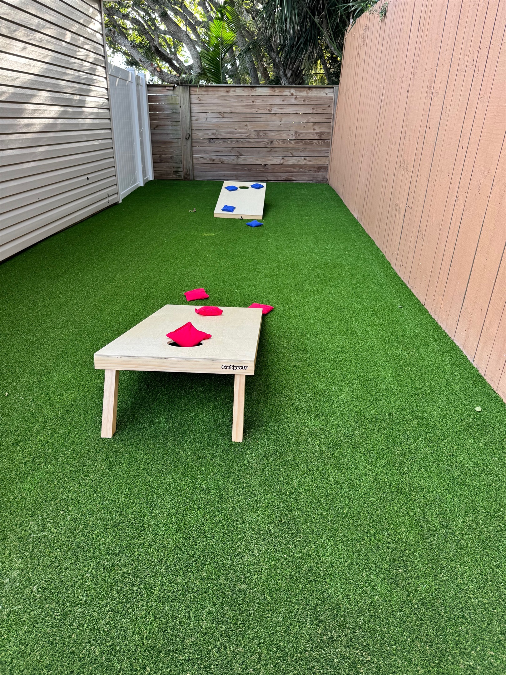 New lawn game area with cornhole