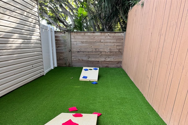 New lawn game area with cornhole