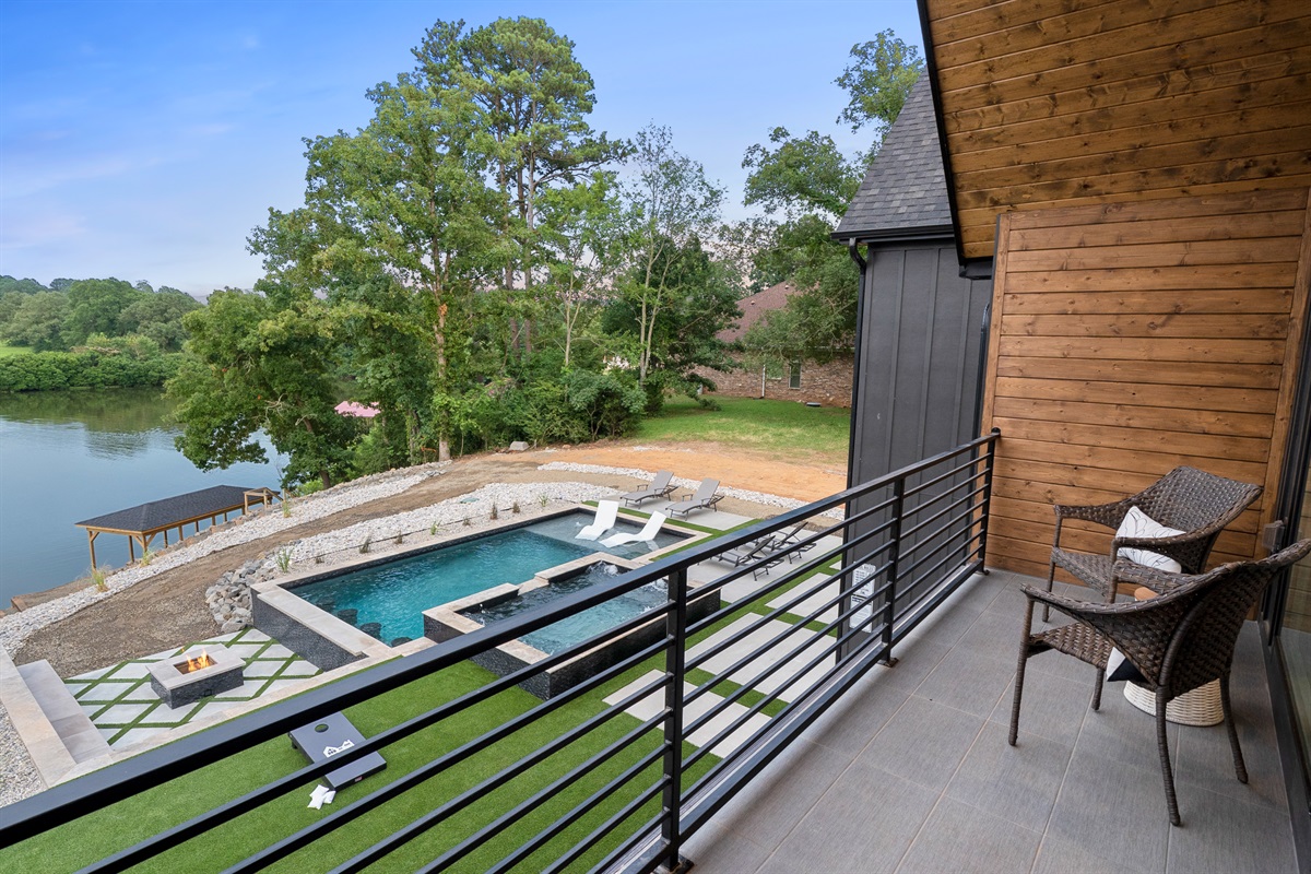 Start your morning with a cup of coffee on our balcony, offering stunning views of the pool and surrounding greenery
