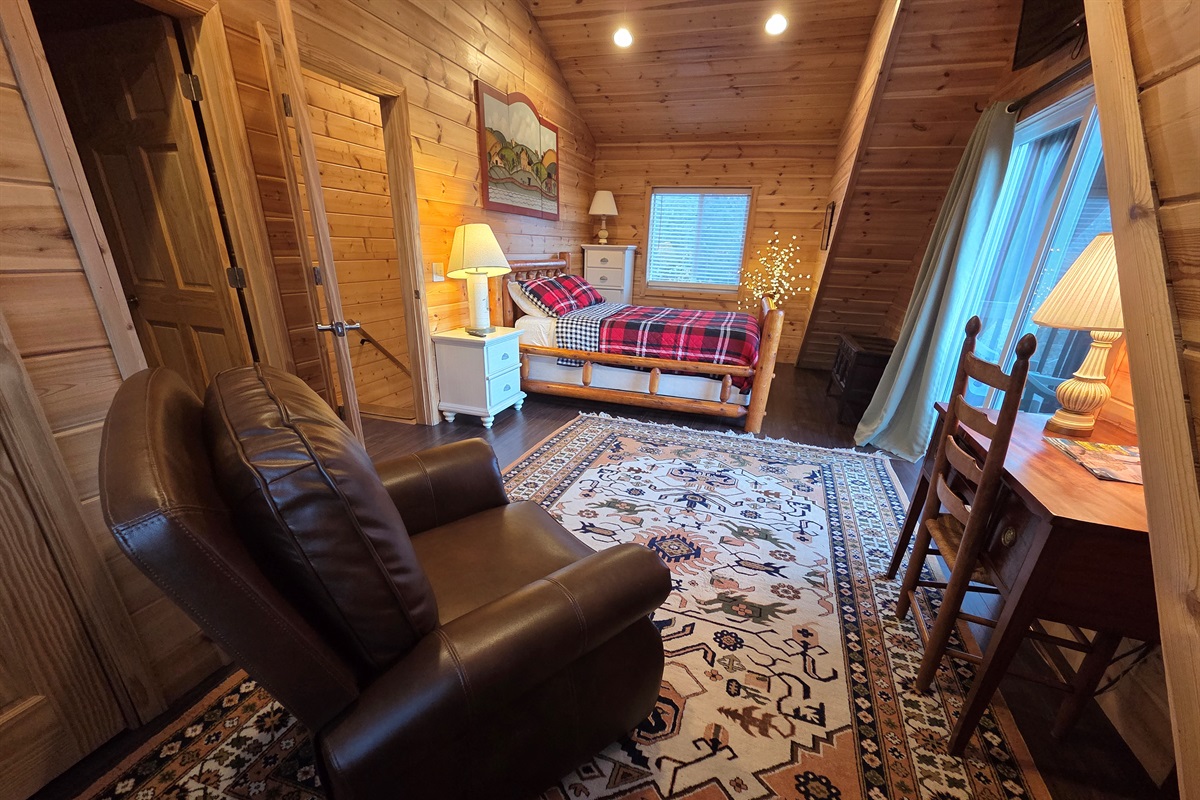 The master bedroom includes a queen-size bed, a Smart TV for streaming, and stunning views that make it the perfect place to relax.