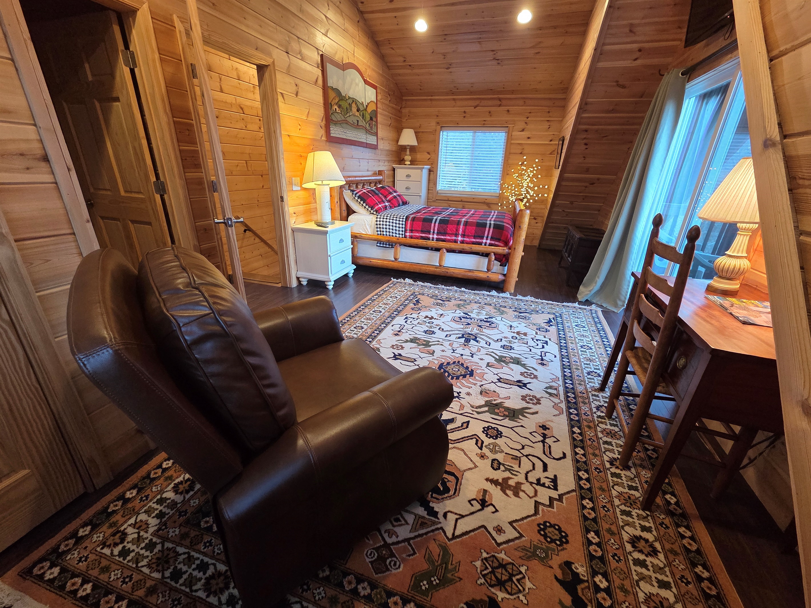 The master bedroom includes a queen-size bed, a Smart TV for streaming, and stunning views that make it the perfect place to relax.