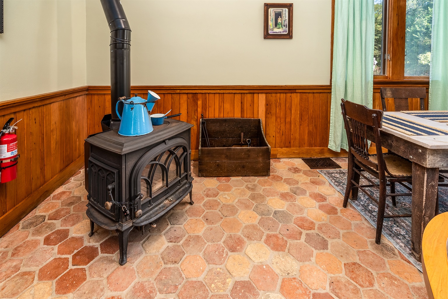 Charming vintage wood-burning stove adds rustic character to the home.