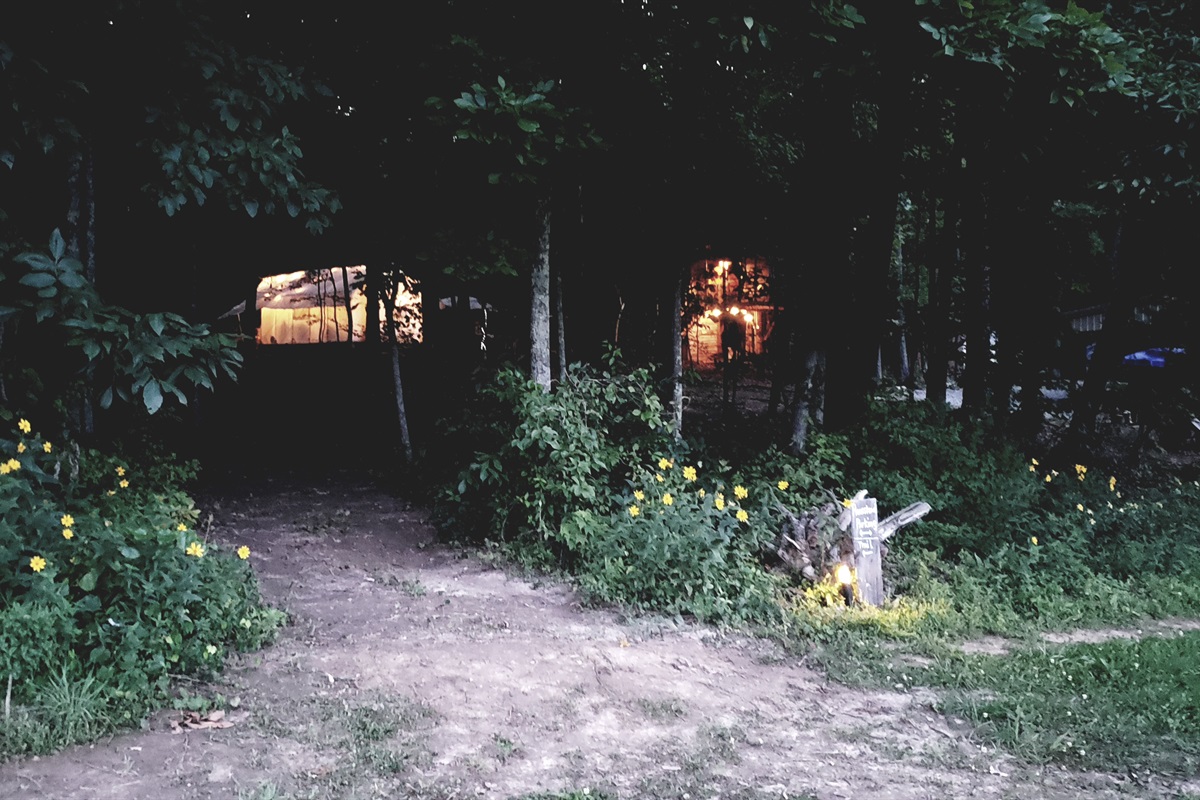 Parking spot and trail leading to tent