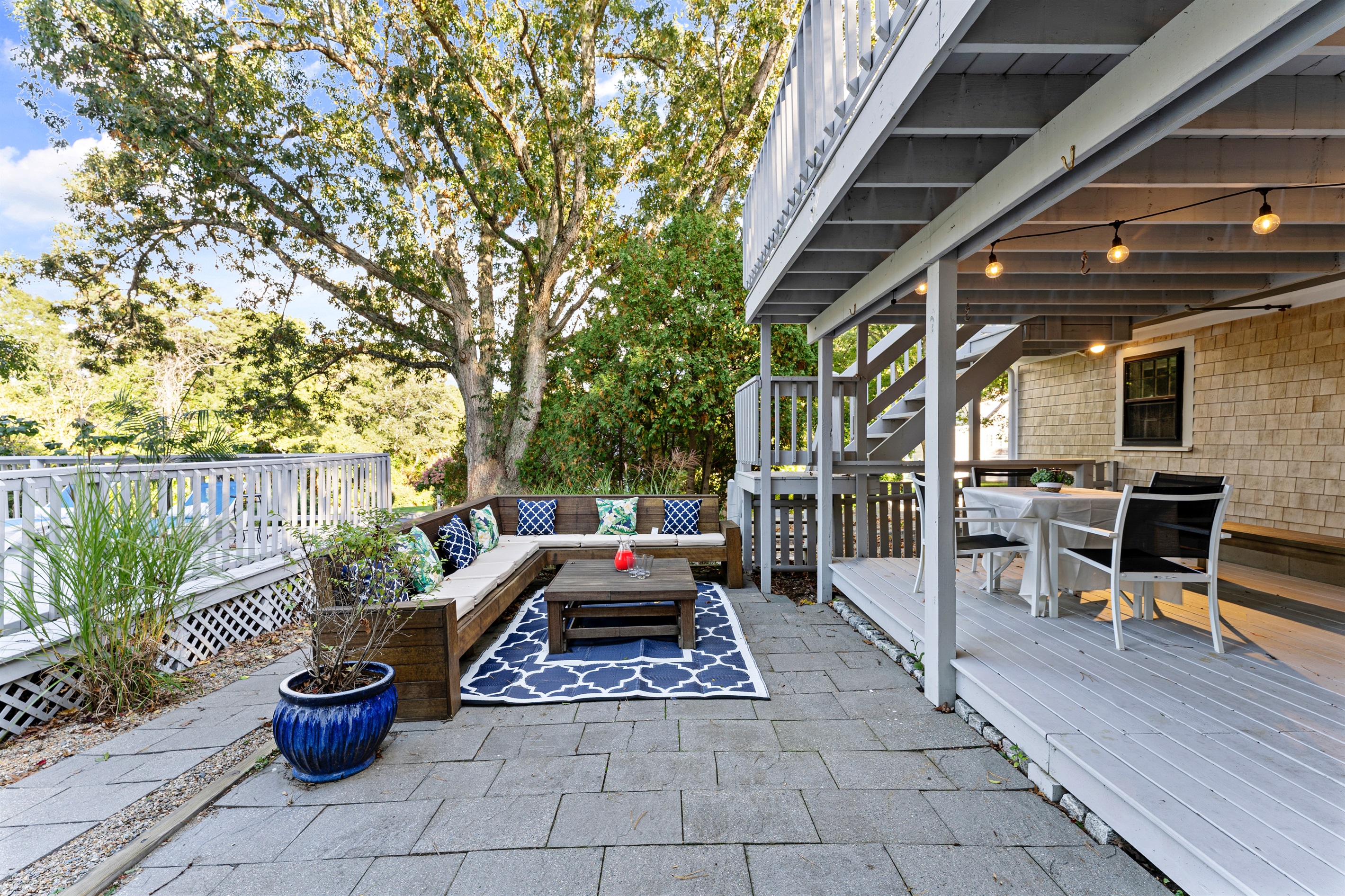 An outdoor sitting area designed for both relaxation and conversation, surrounded by the beauty of nature.