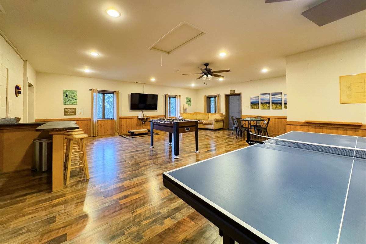 Our game room features foosball, ping pong table, ring toss, card table, kids's air hockey(floor model), Smart TV, kitchenette, bathroom, sauna, and more.